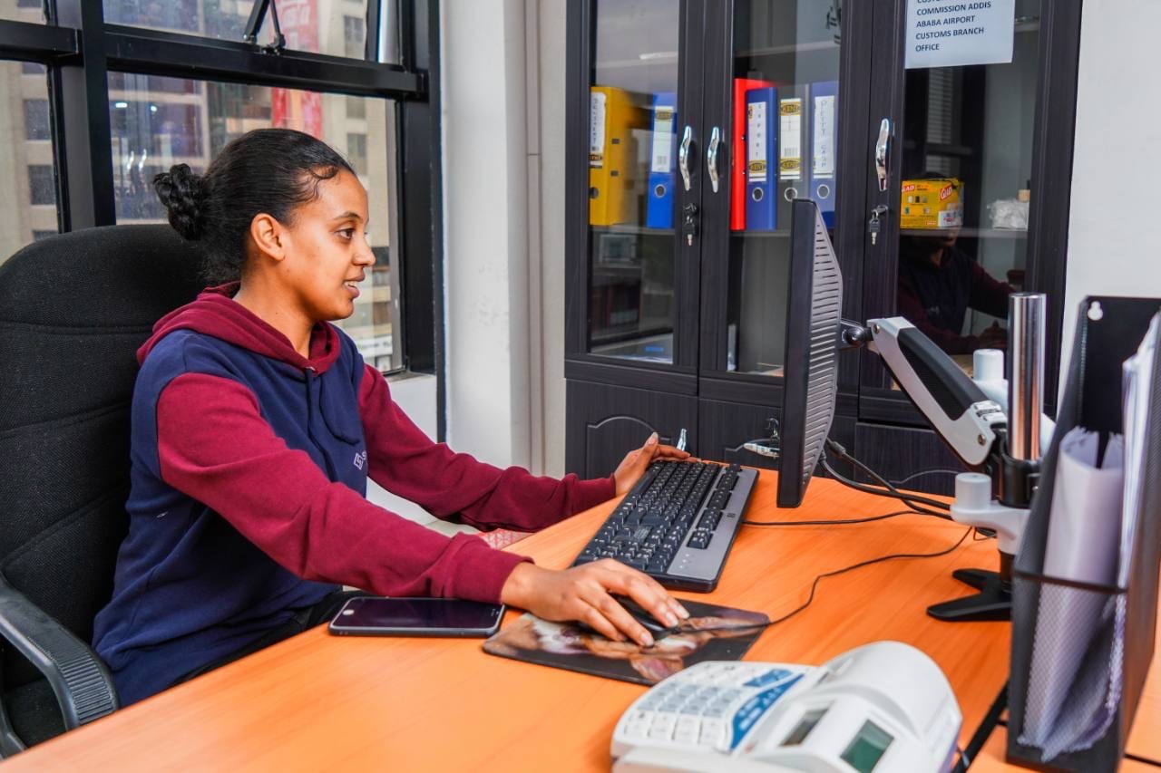 Shareway team member assisting customers from the office